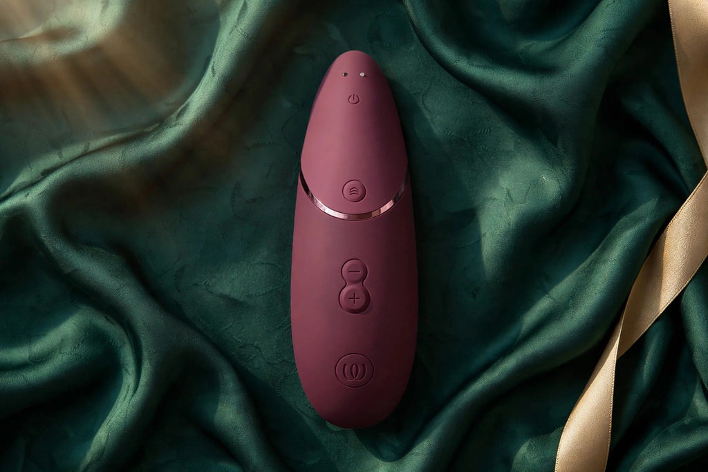 Womanizer Next Bordeaux — flatlay view